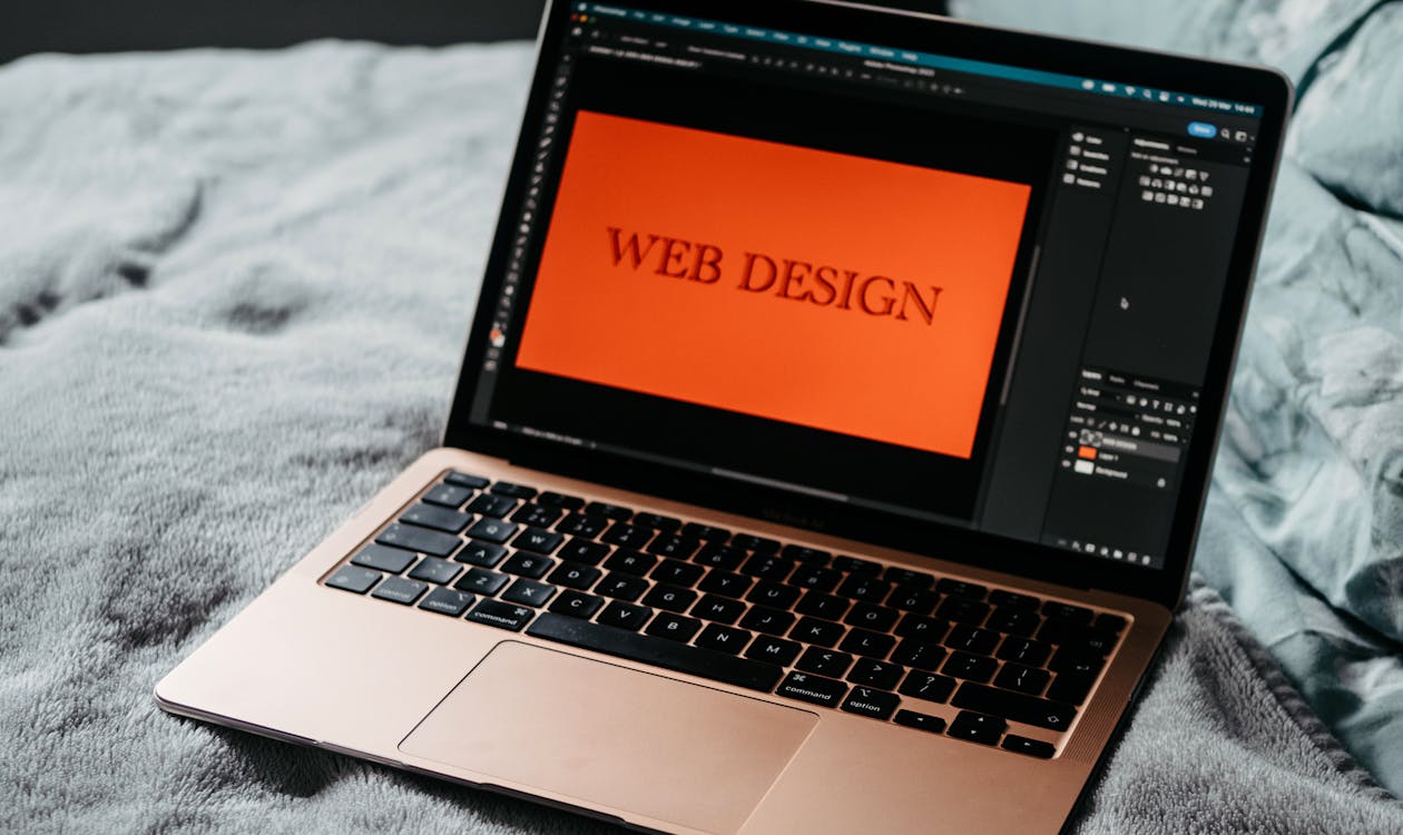 Open laptop showing hotel website design examples