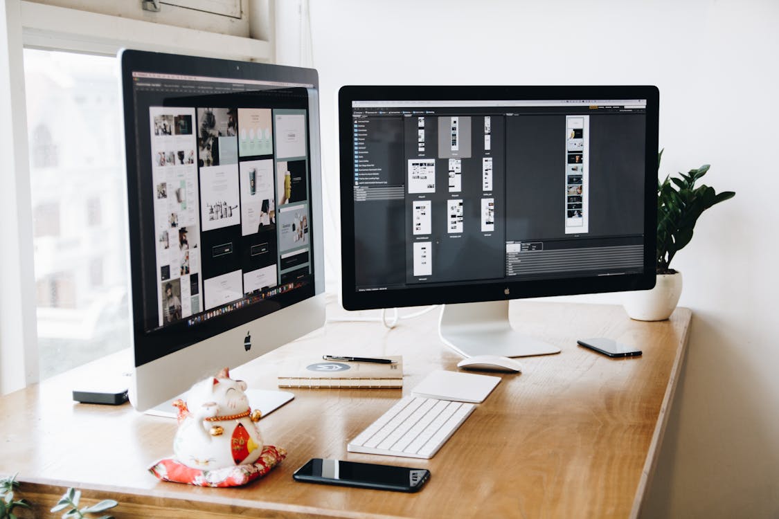 Multi-screen design workspace showing hotel website UX design