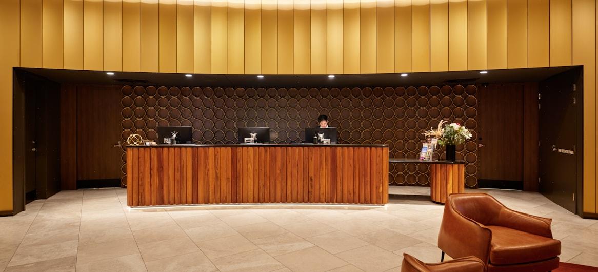 Modern hotel reception desk — hotel direct booking rate benchmark