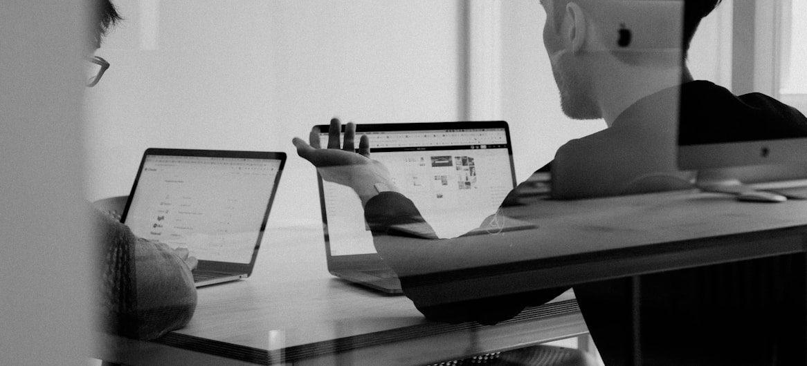 Man Using MacBook Hotel Website SEO