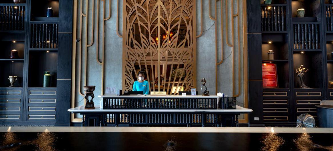 Hotel receptionist at luxurious front desk